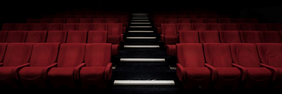 Interior of a theater in which all of the seats are empty